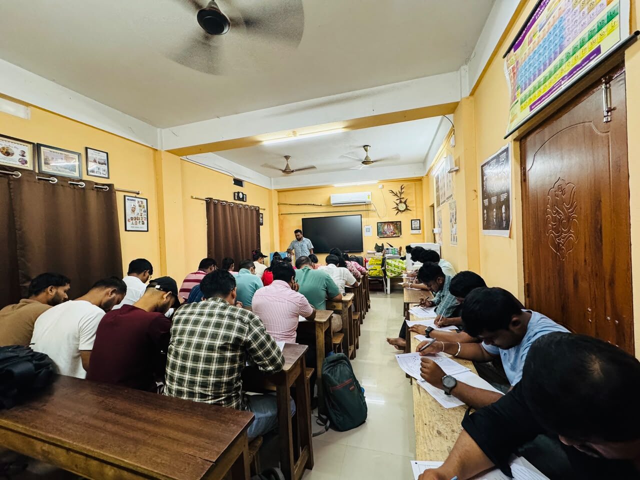 Students at their desks during a session